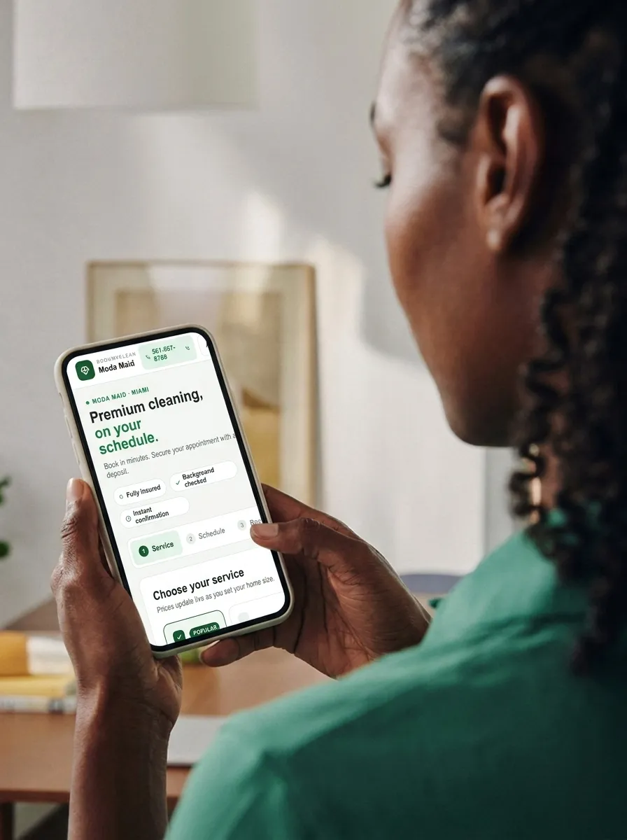 Cleaning business owner viewing the BookMyClean booking page on her phone